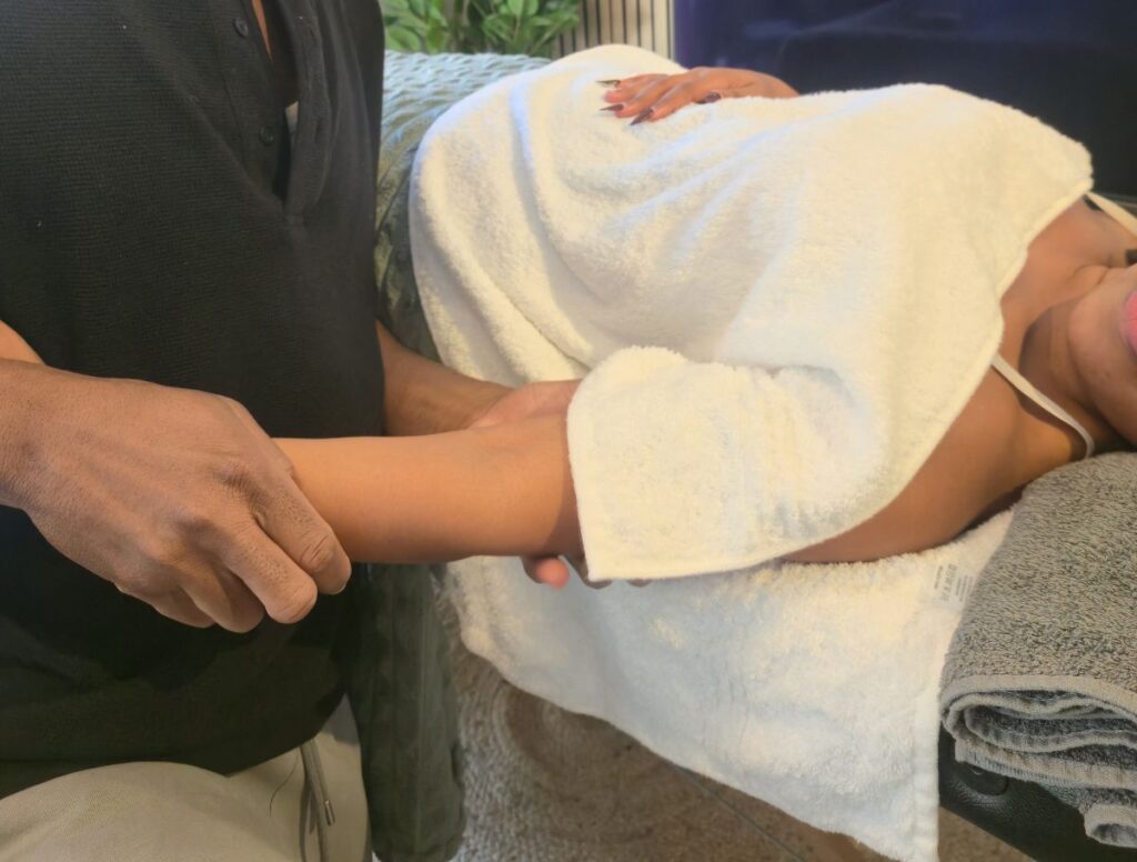 Client appropriately covered with towels during a professional mobile massage treatment
