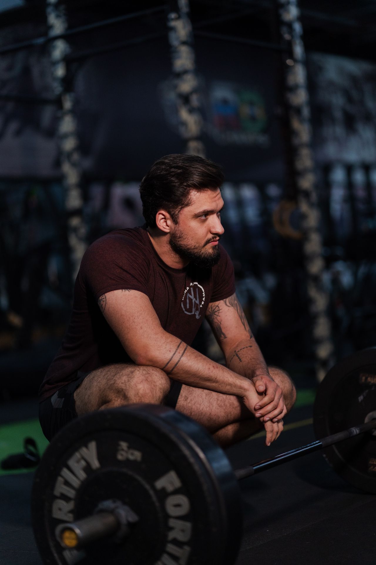 Person resting after weight training in a gym